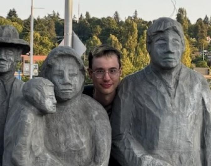 Ian Gwin among statues