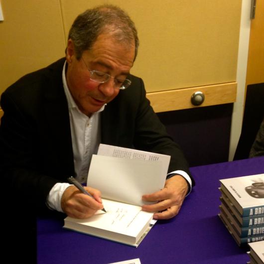 Göran Rosenberg meets with students and signs books (Photo: Hannah Pressman, UW Jewish Studies)