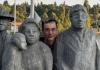 Ian Gwin among statues