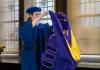 Dr. Amanda Doxtater giving the doctoral hood to a PhD graduate